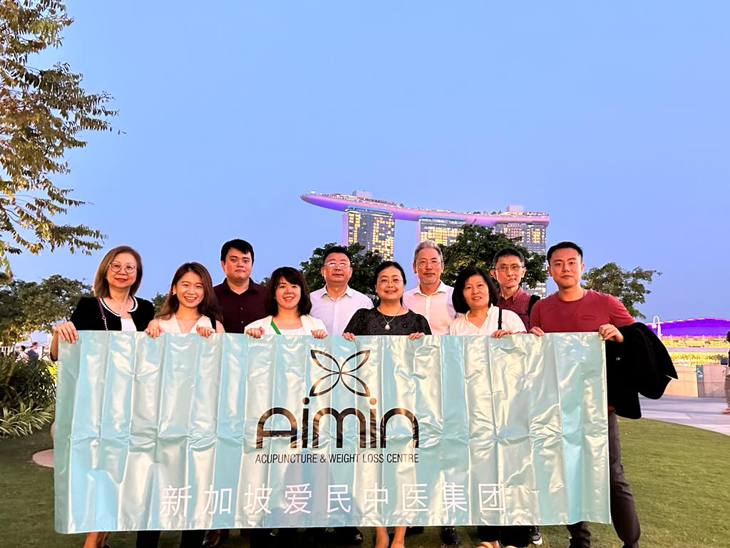 Aimin TCM Clinic staff group photo at charitable event