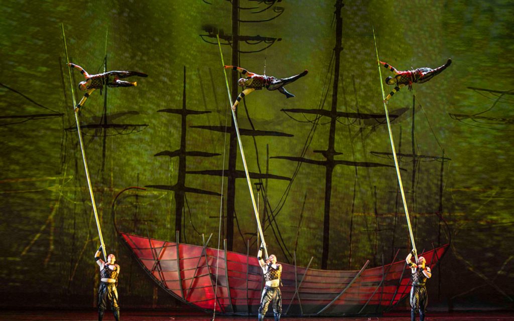 Dancers performing elegant Swan Lake choreography with acrobatic elements
