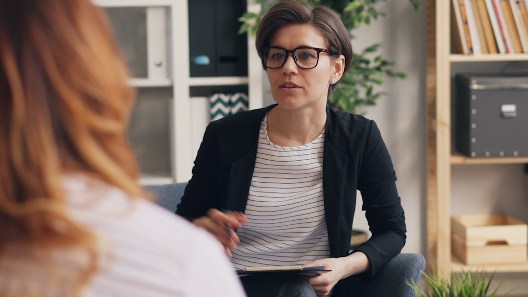 TCM practitioner consulting with patient about herbal treatment